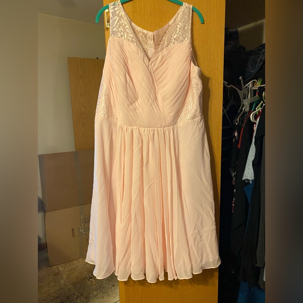 Size 18 wedding or prom dress. Has a beautiful lace back with buttons.